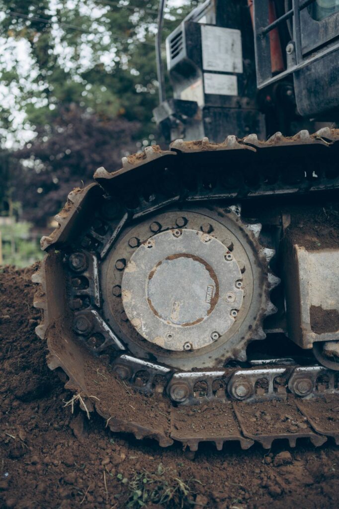Excavator preparing a lakeside property for septic tank installation