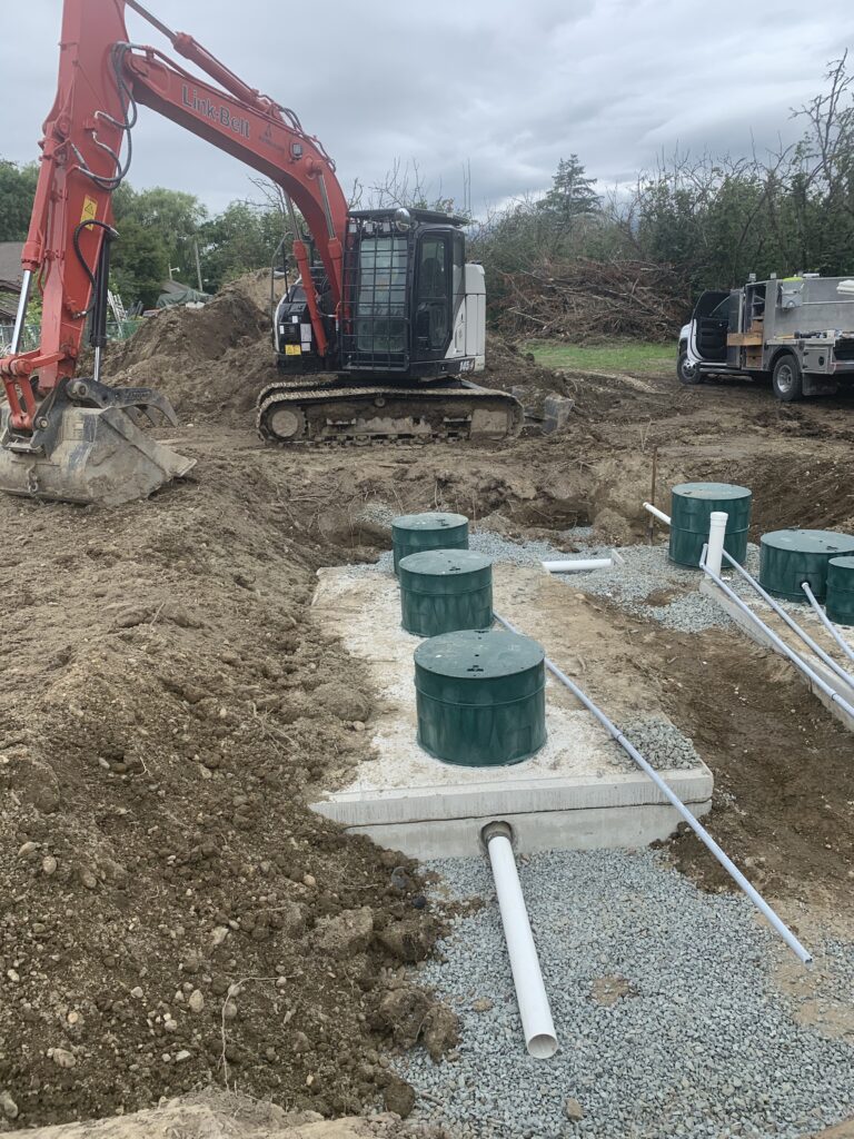 Excavator preparing a rural property for septic tank installation
