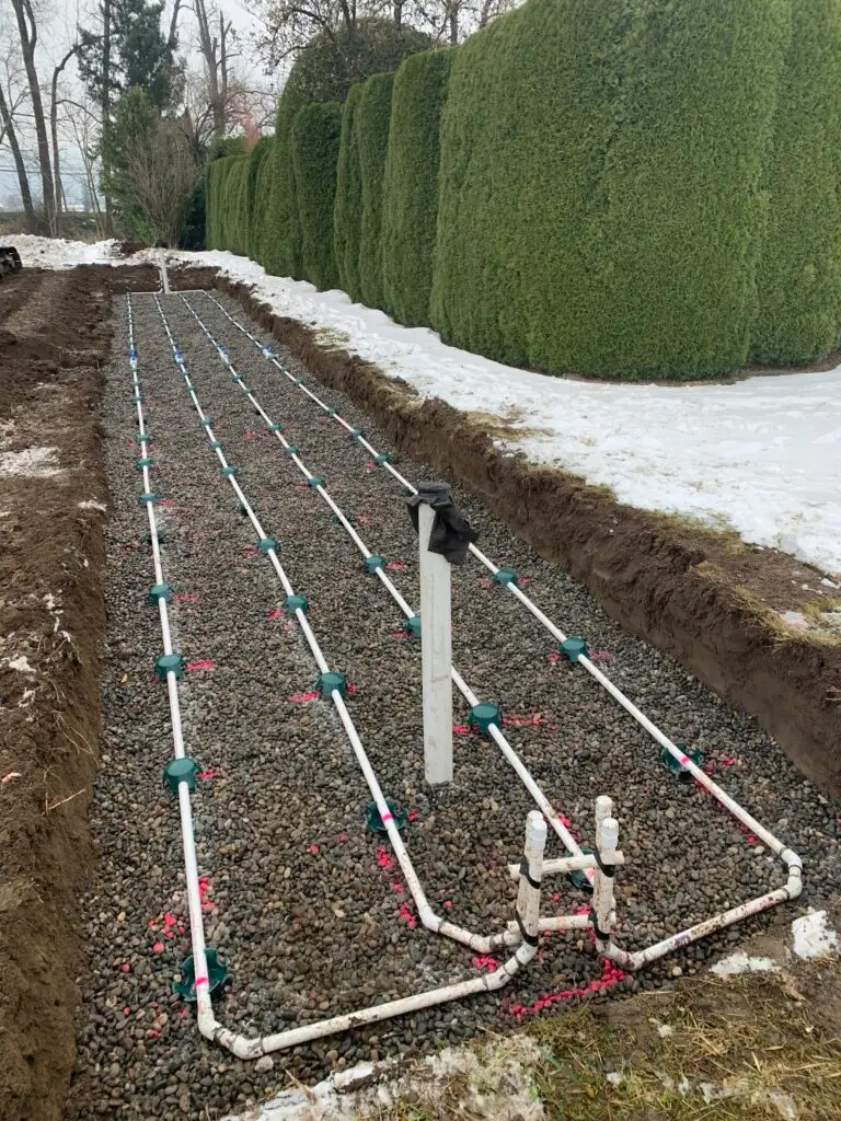 Excavator preparing an Agassiz property for septic system installation