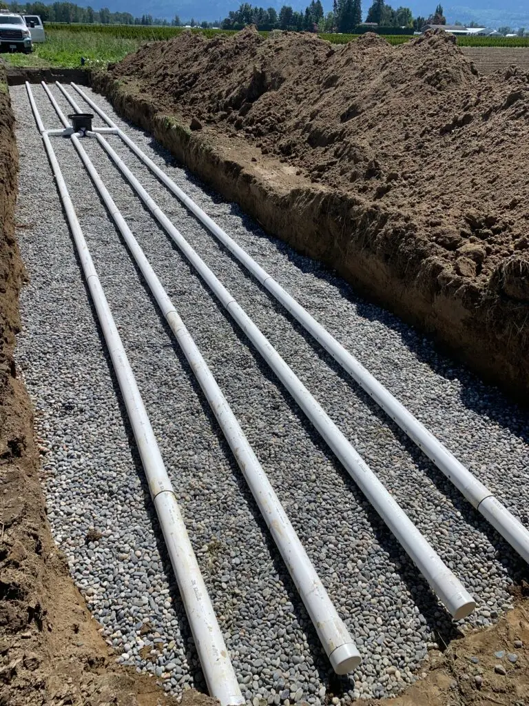 Septic drain field installation on a sloped mountain property